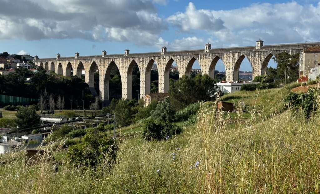 a stone bridge with arches