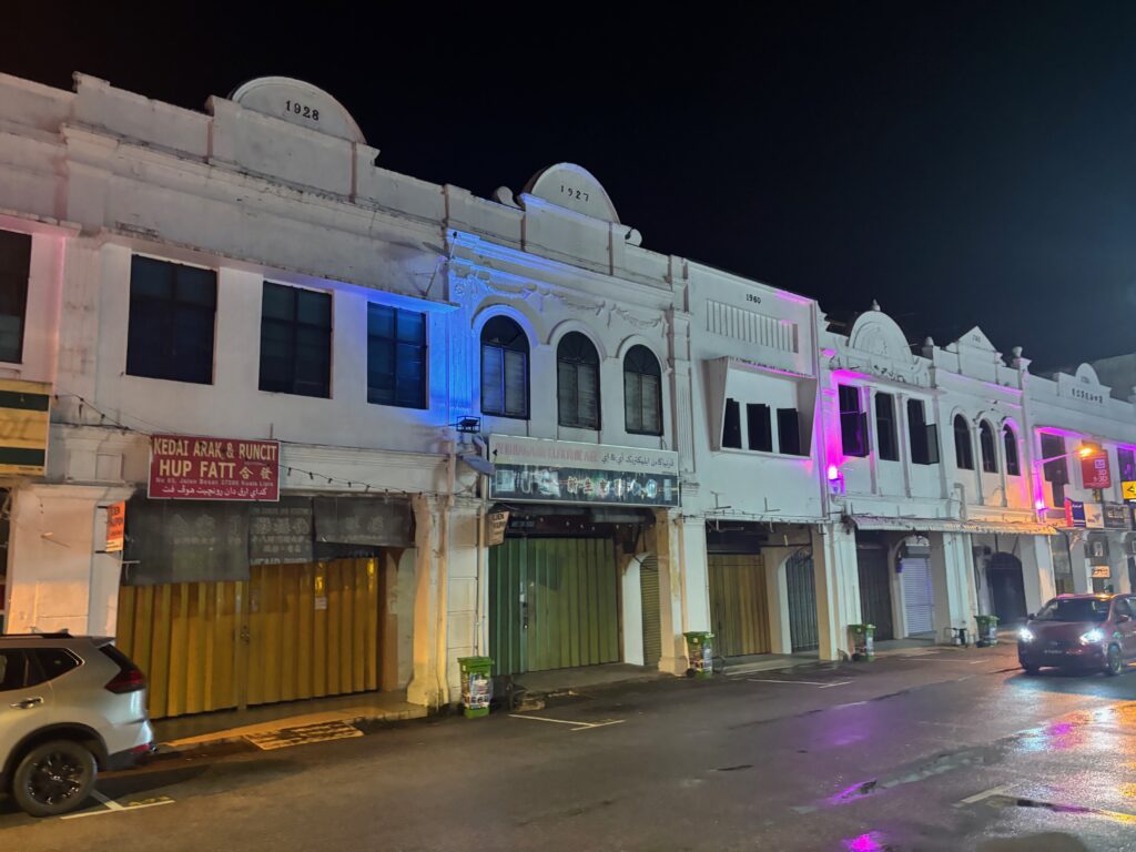 a building with purple lights on the side of it