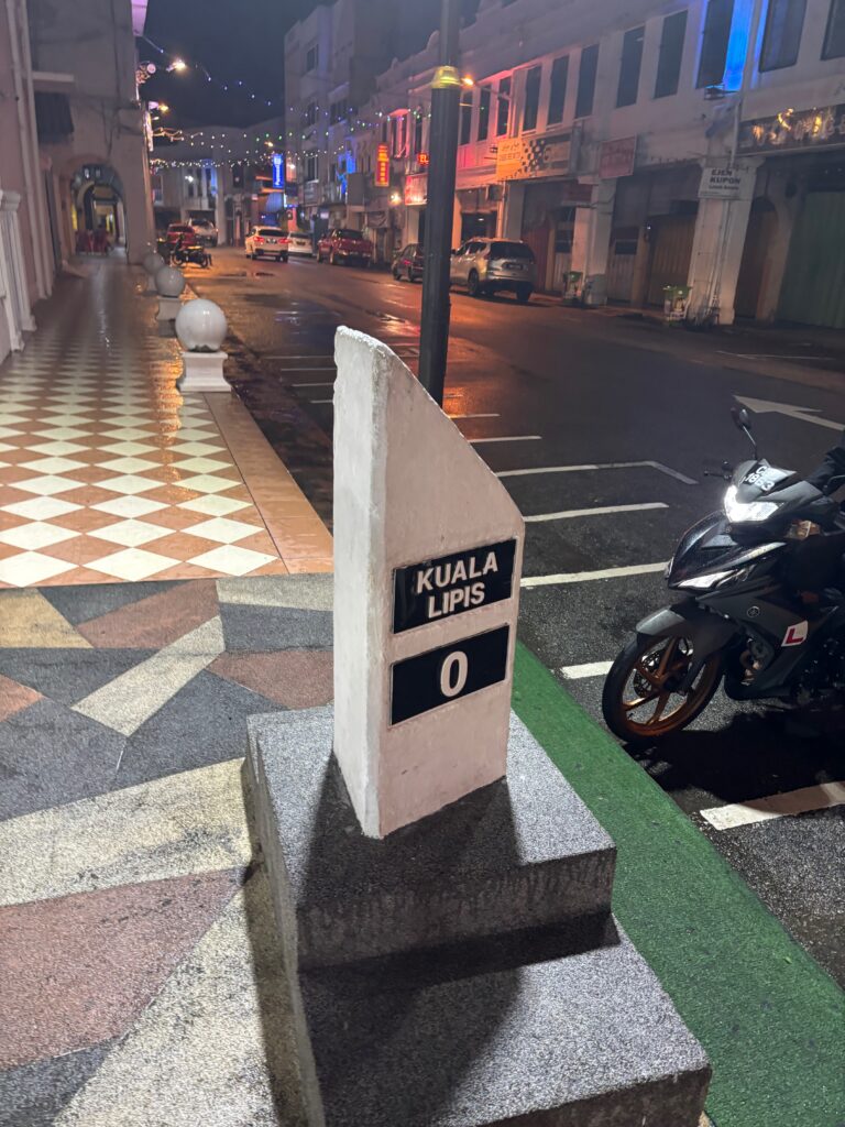 a street sign on a sidewalk