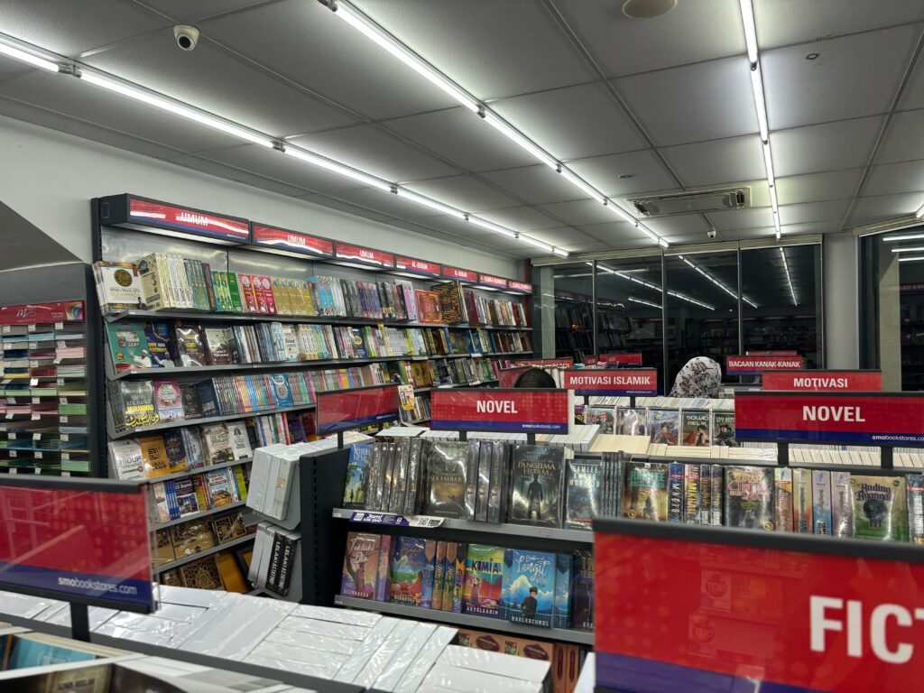 a store with shelves of books and dvds