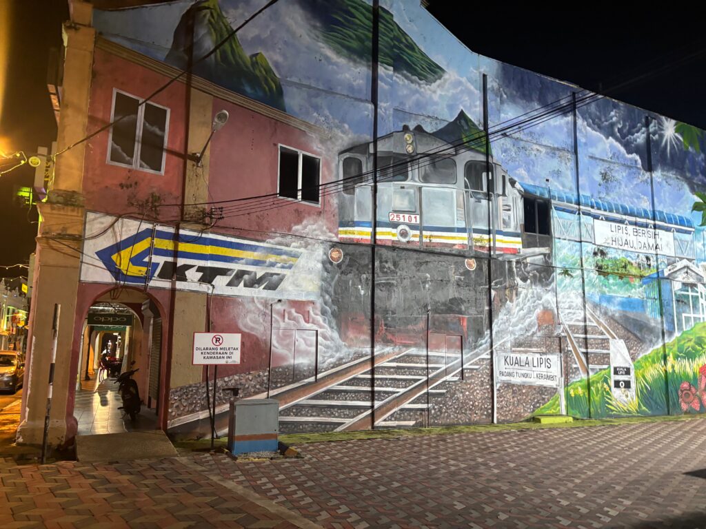 a mural of a train on a building