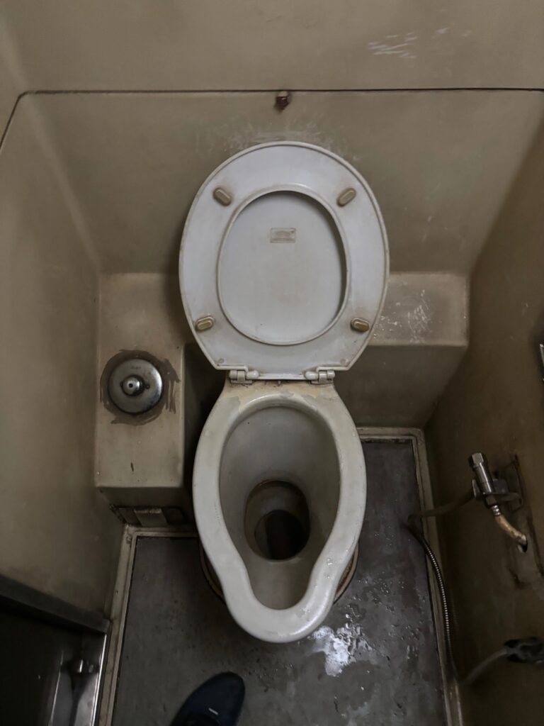 a toilet in a small bathroom