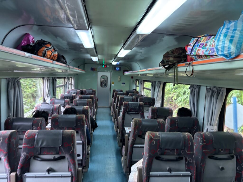 a bus with seats and a shelf