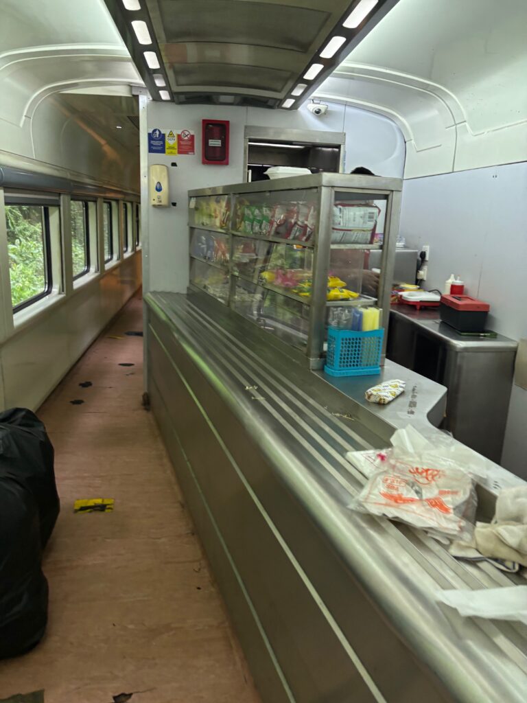 a food truck with a counter and a few windows