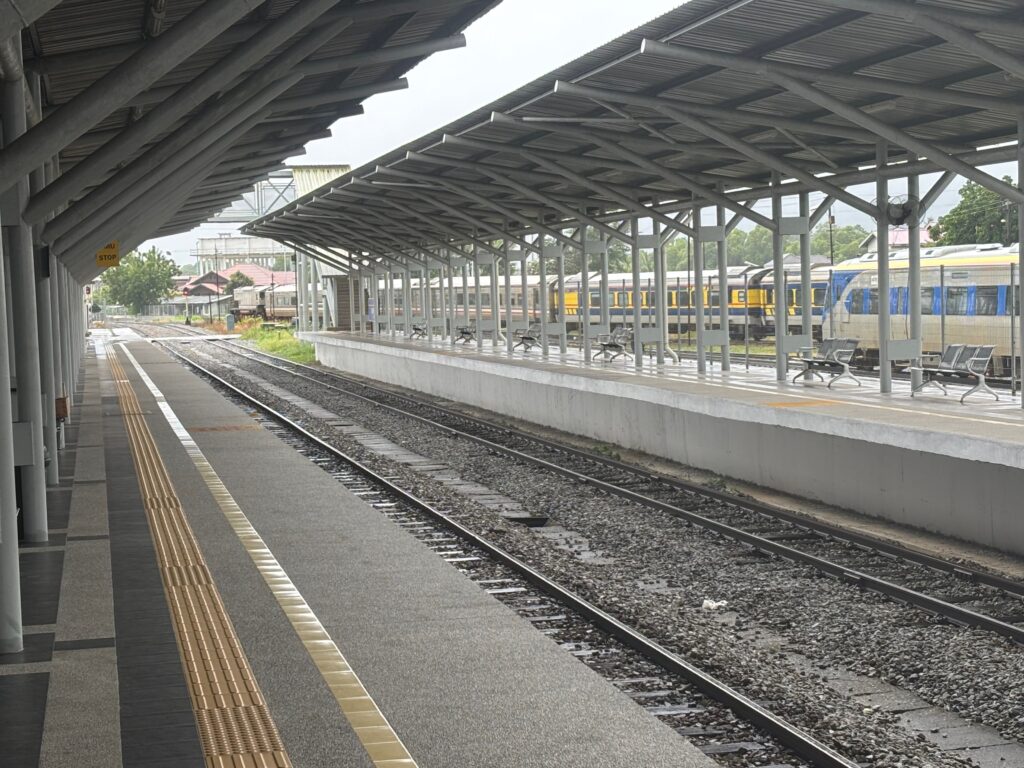 a train station with a train and a train