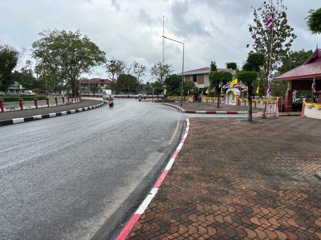 a road with trees and buildings