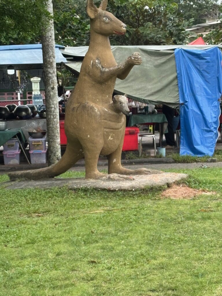 a statue of a kangaroo in a park