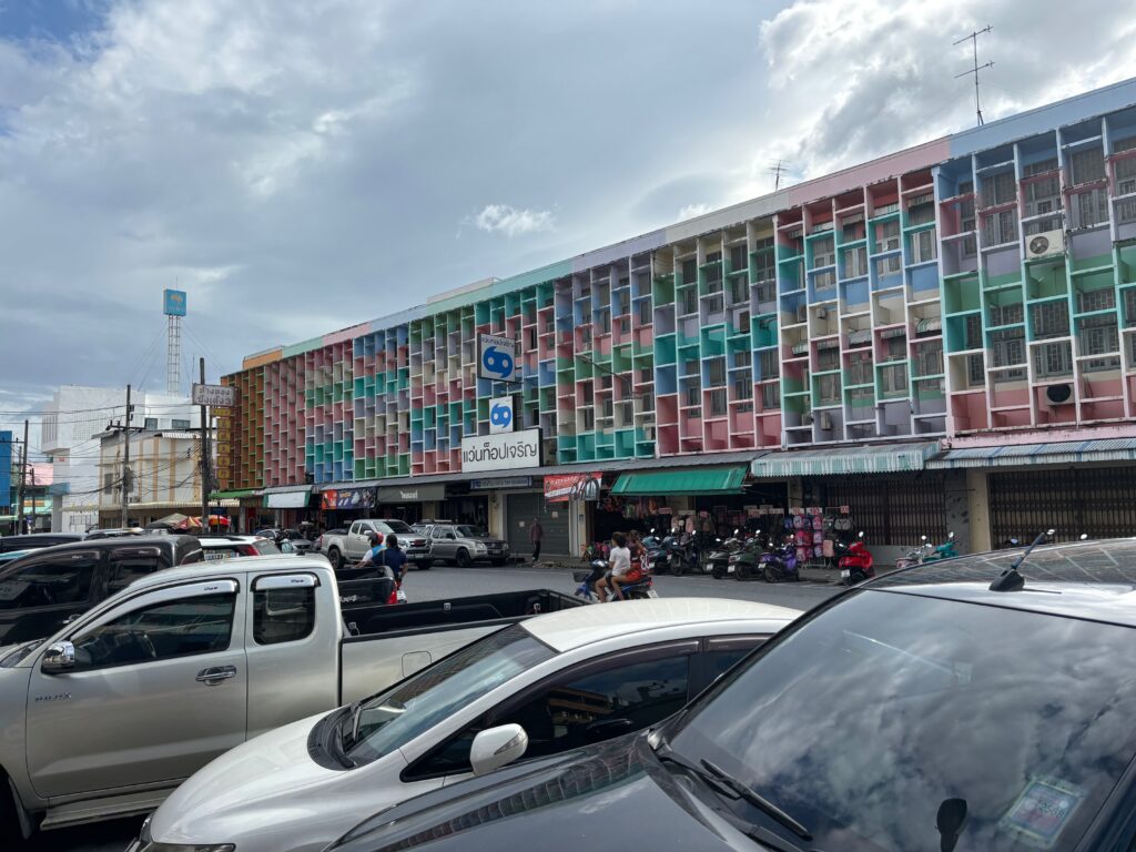 a multicolored building with many windows