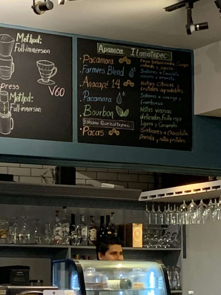 a man standing behind a bar