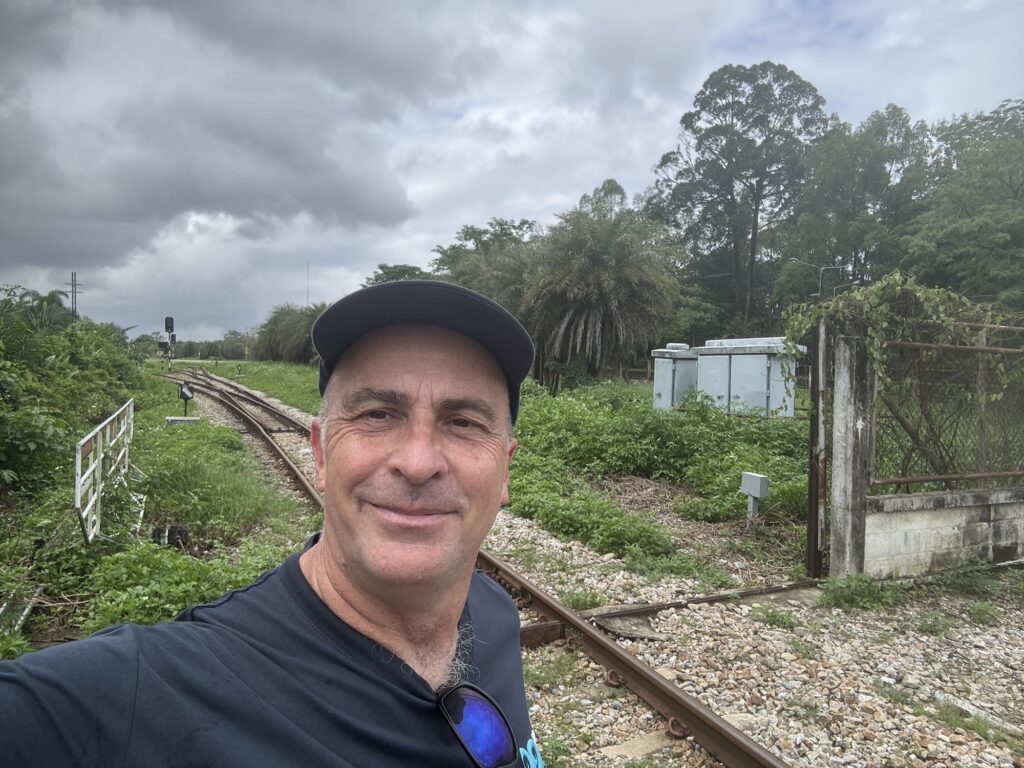 a man taking a selfie on train tracks