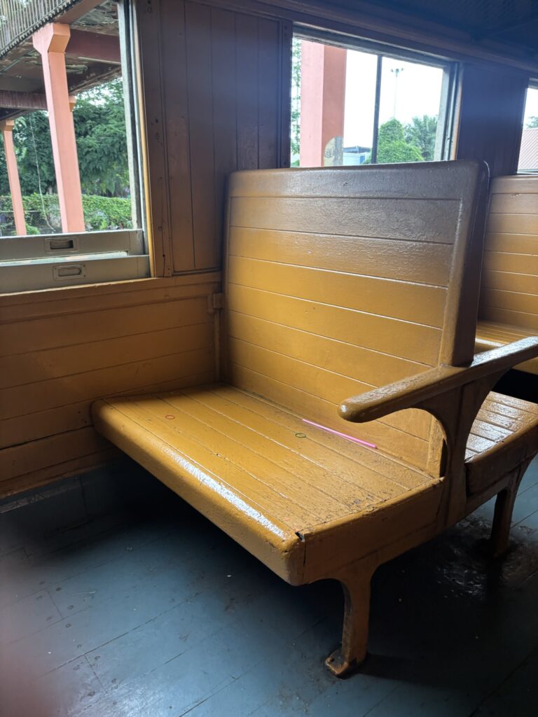 a yellow bench in a room