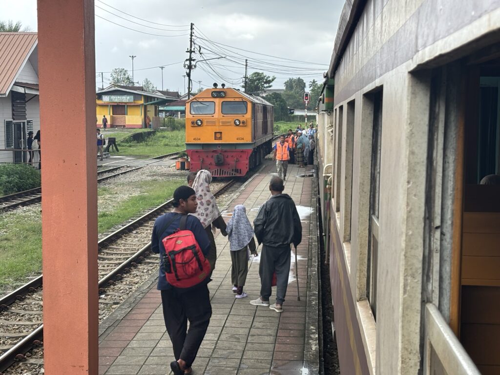 people walking on a train platform