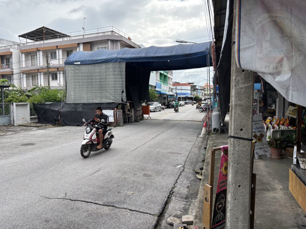 a man riding a scooter on a street