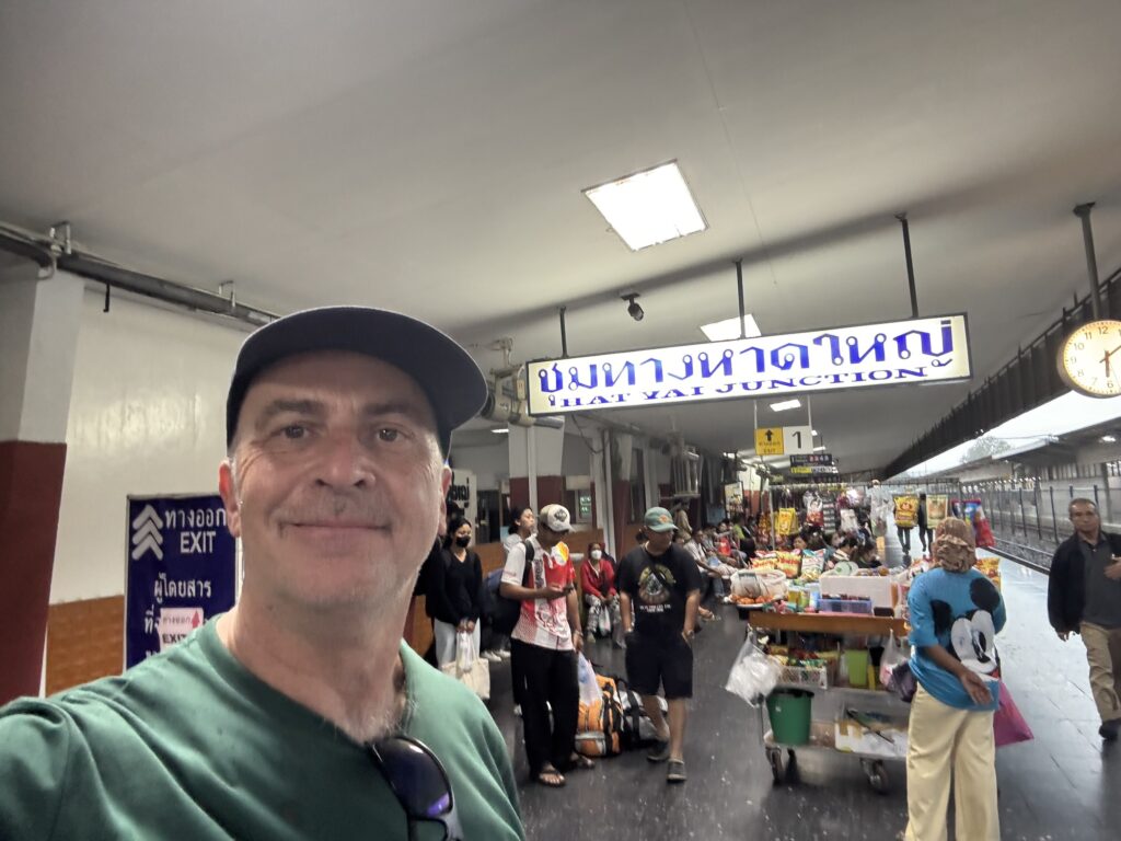 a man taking a selfie in a market