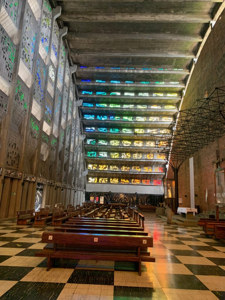 a inside of a church with stained glass windows