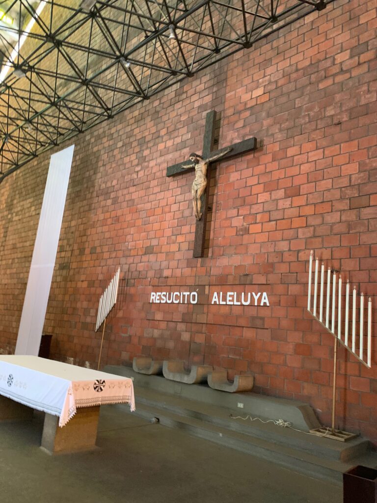 a brick wall with a cross on it