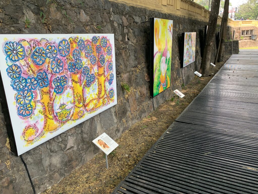 a group of paintings on a wall