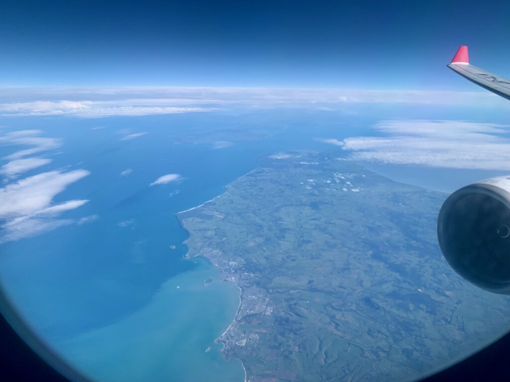 an aerial view of land and water