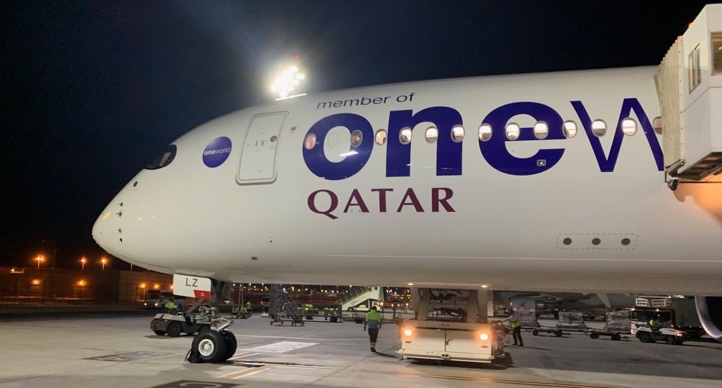 a plane with a group of people around it