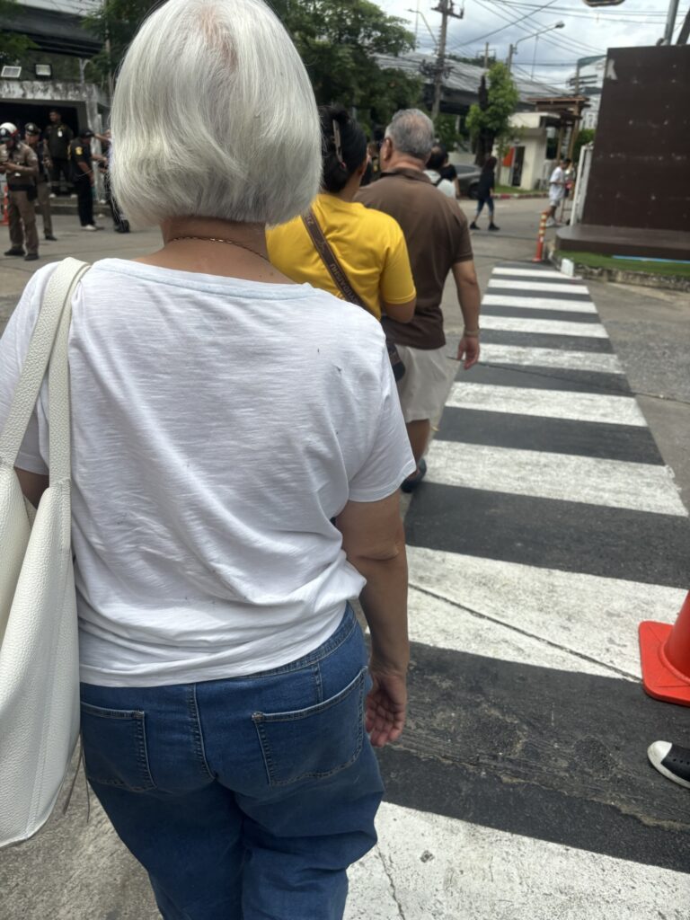a group of people walking on a crosswalk