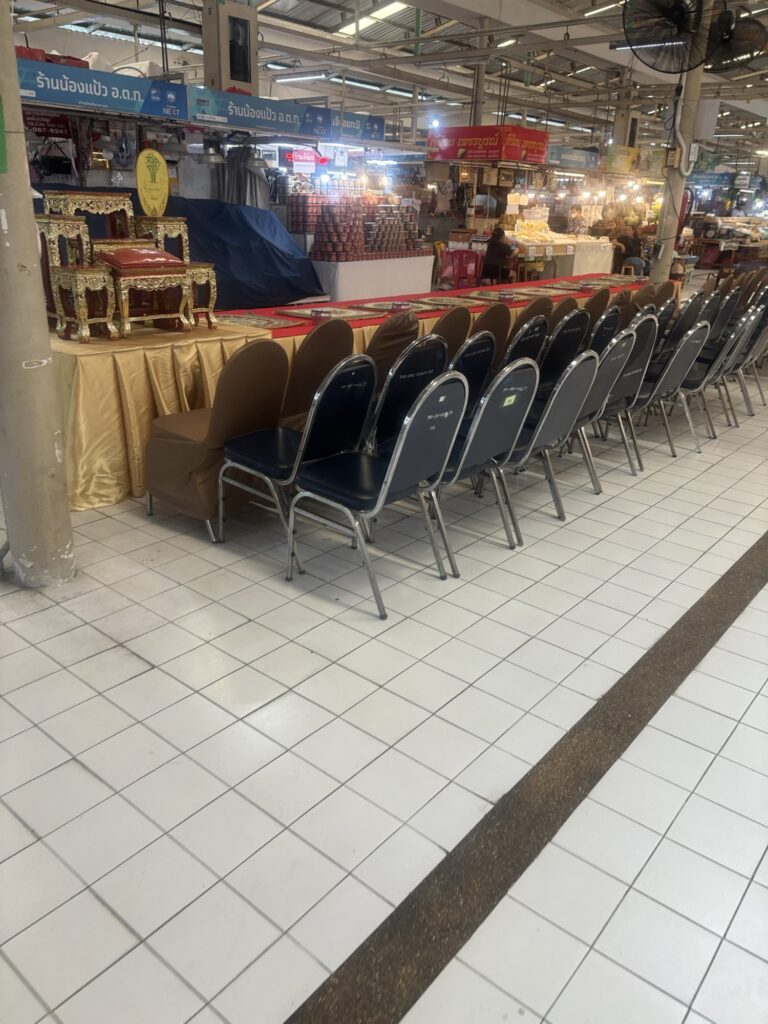 a row of chairs in a market