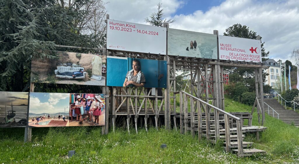 a group of signs on a wooden structure