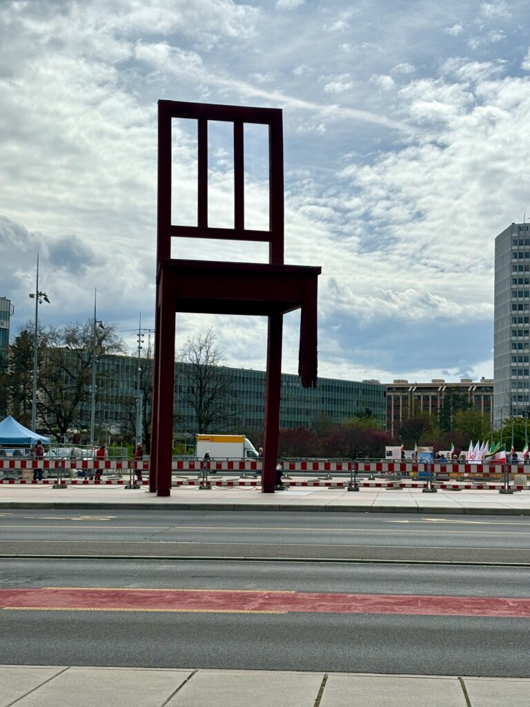 a large chair on the side of a road
