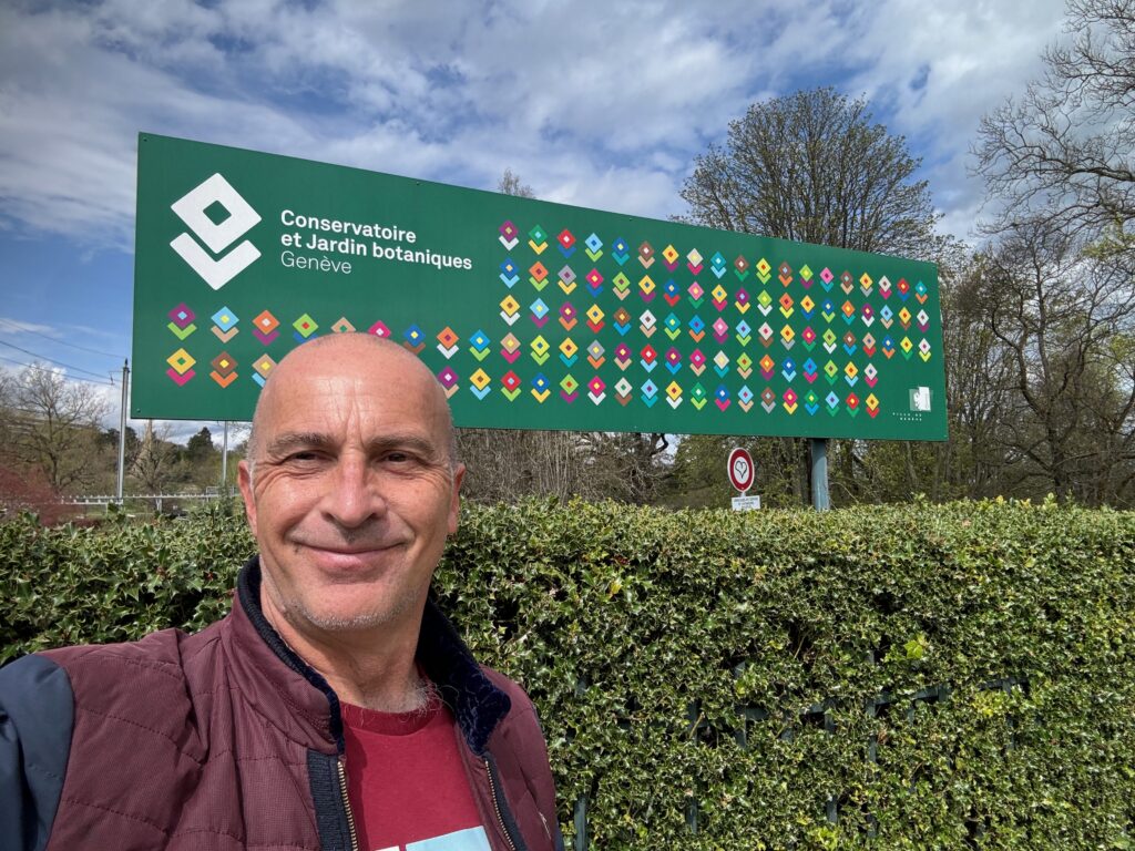 a man standing in front of a sign