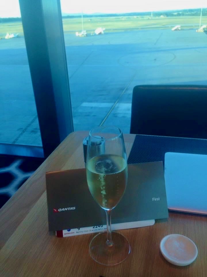 a glass of champagne on a table