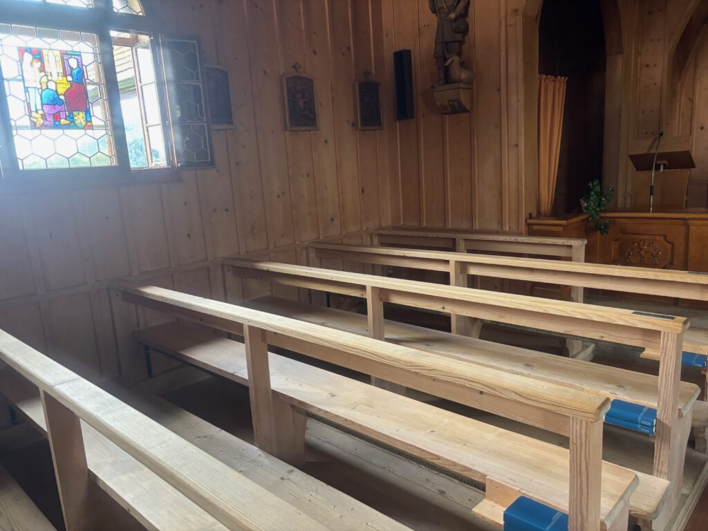 a wooden benches in a church