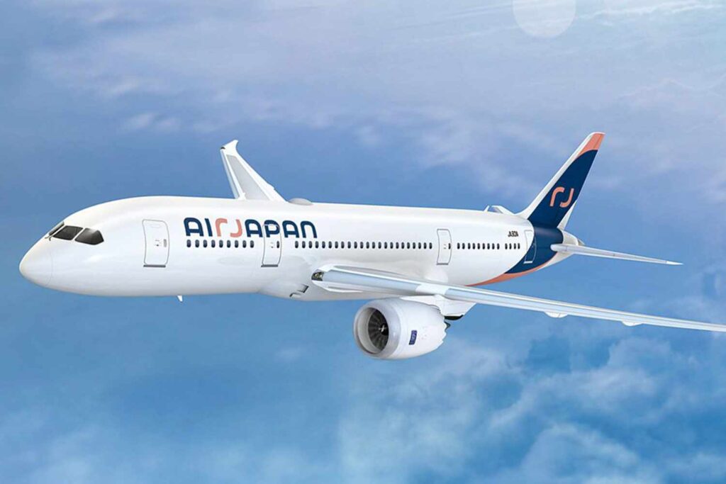 a white air japan airplane in the sky