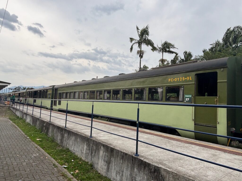 a green train on a track