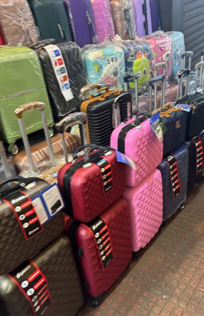 a stack of luggage in a store
