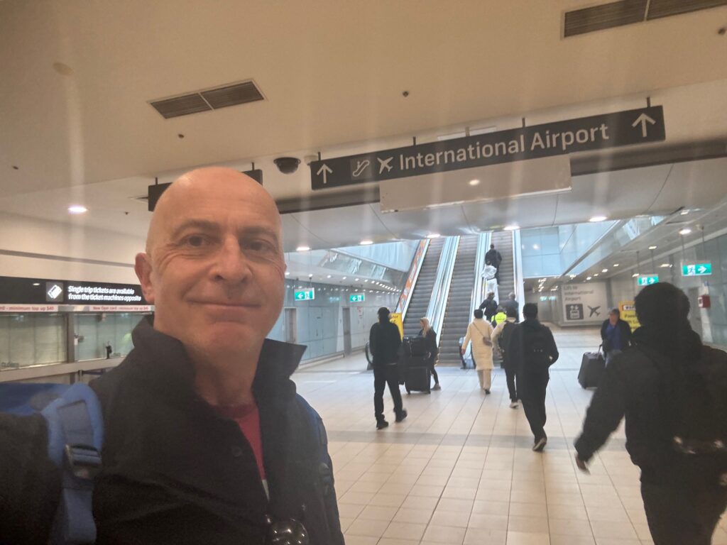 a man taking a selfie in a airport