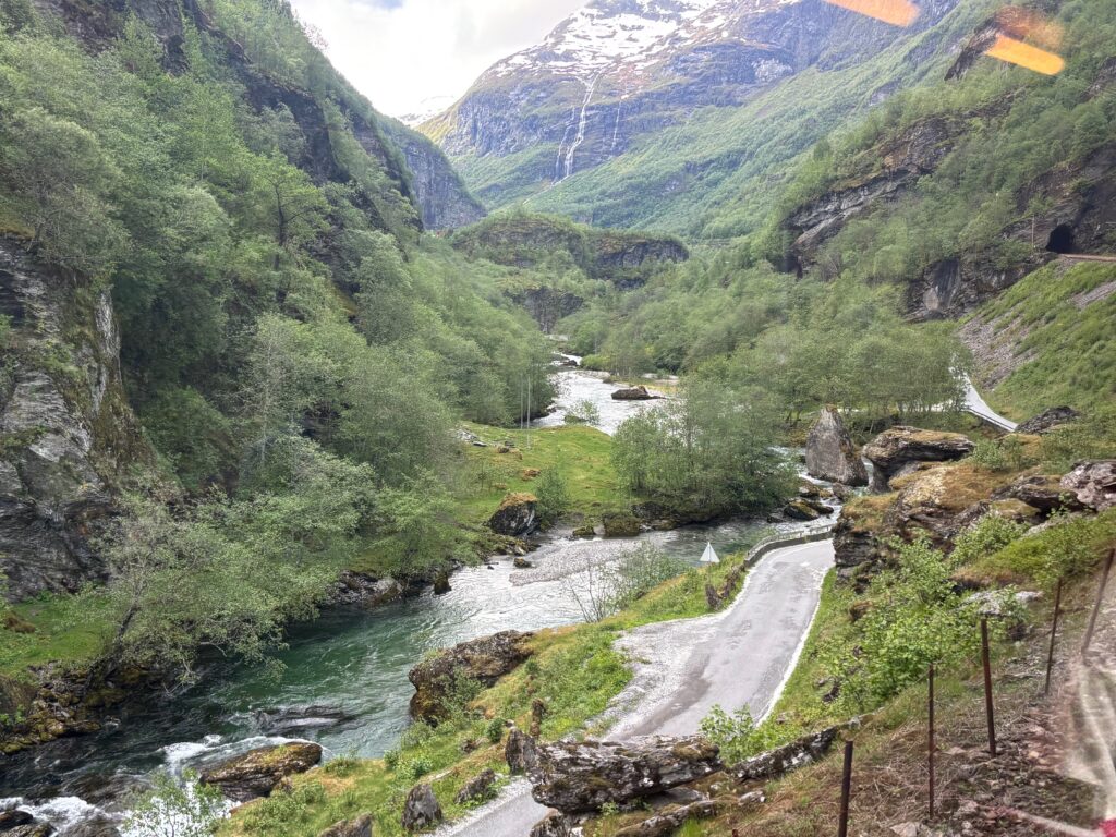 a river running through a valley with Kennon Road in the background