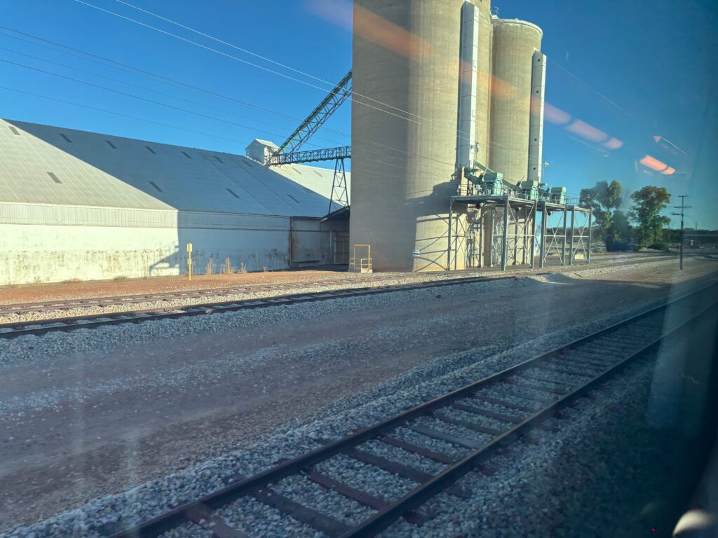 train tracks next to a building