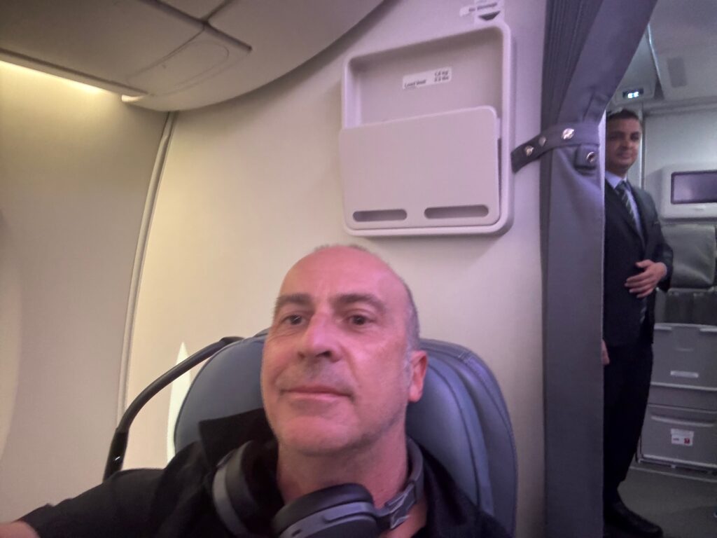 a man sitting in a chair with headphones on