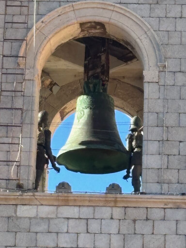 a bell in a stone building