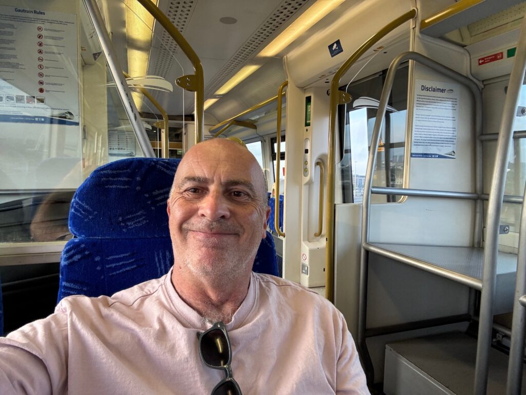 a man sitting in a blue chair