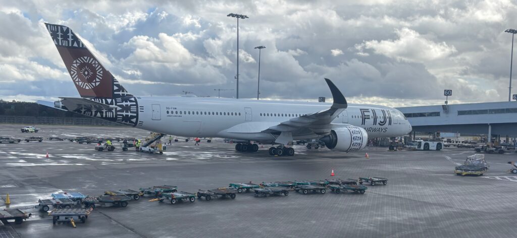 a large white airplane on a runway