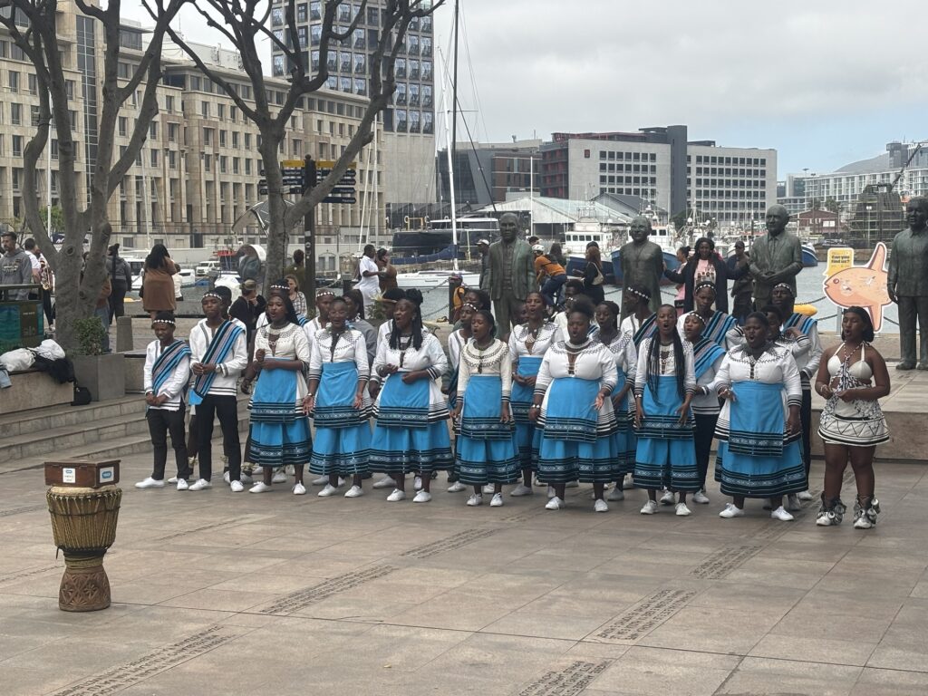 a group of people wearing blue and white dresses