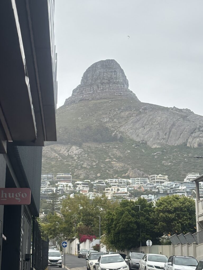 a mountain with buildings in the background