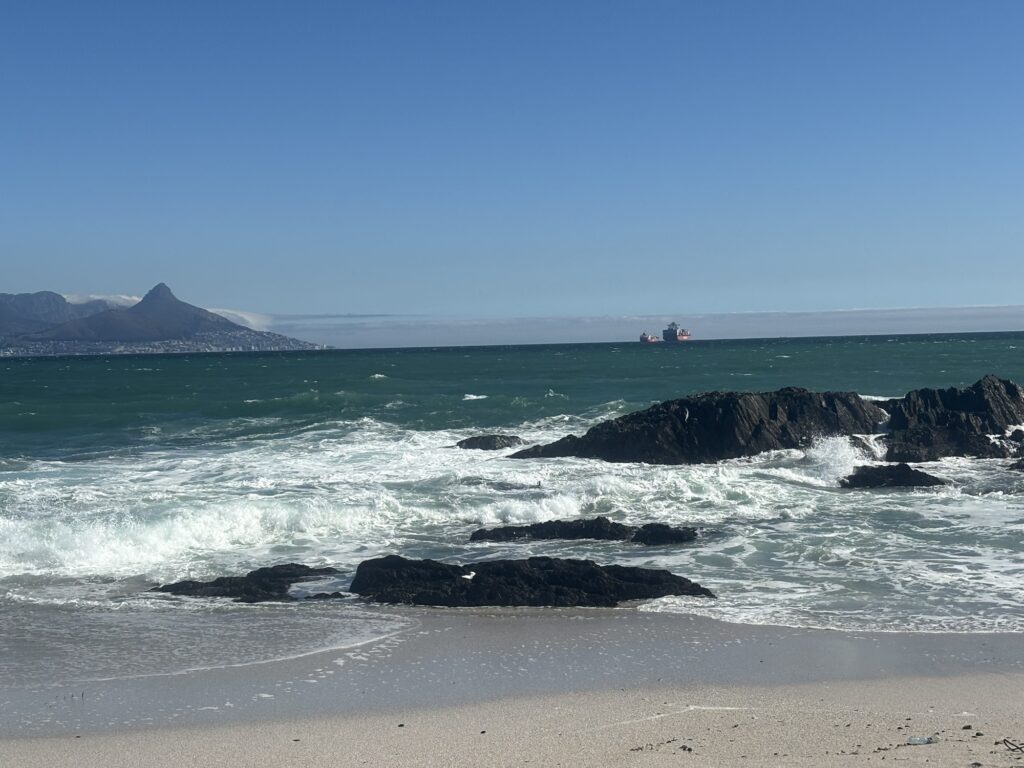 a beach with rocks and waves