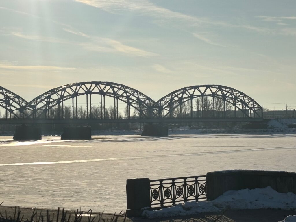 a bridge over a frozen river