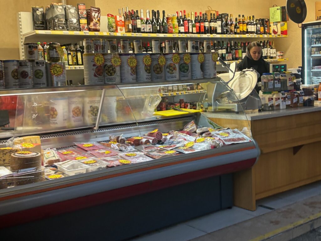 a store with a counter and shelves of food