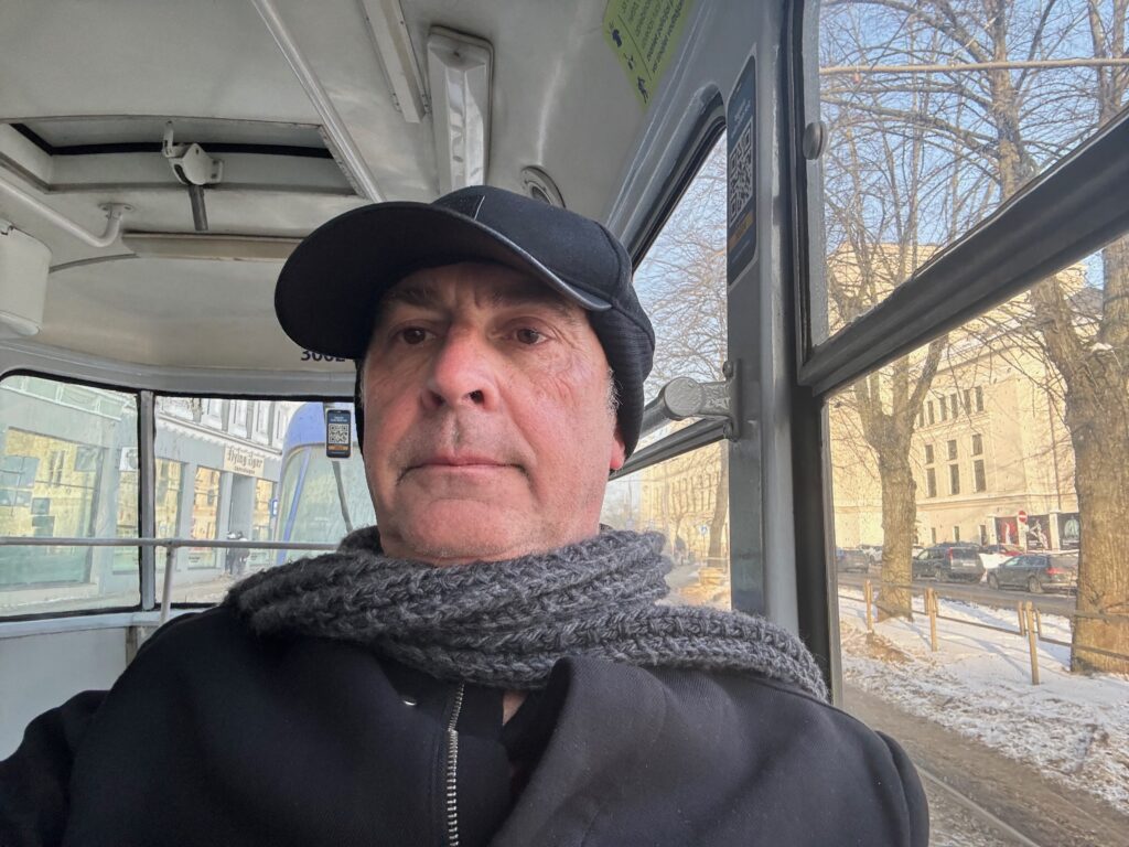 a man in a hat and scarf