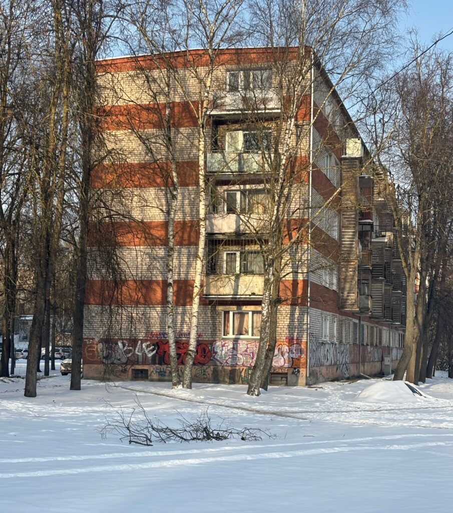 a building with trees in the snow