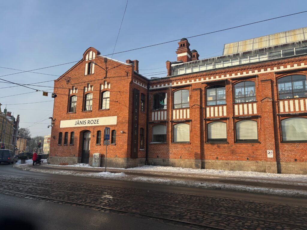 a brick building with snow on the ground