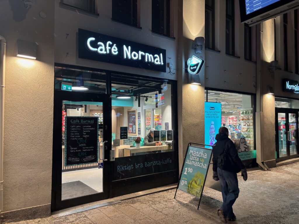 a man walking in front of a store