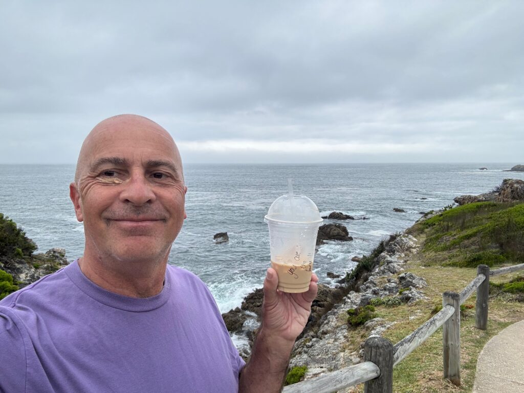 a man holding a cup of coffee